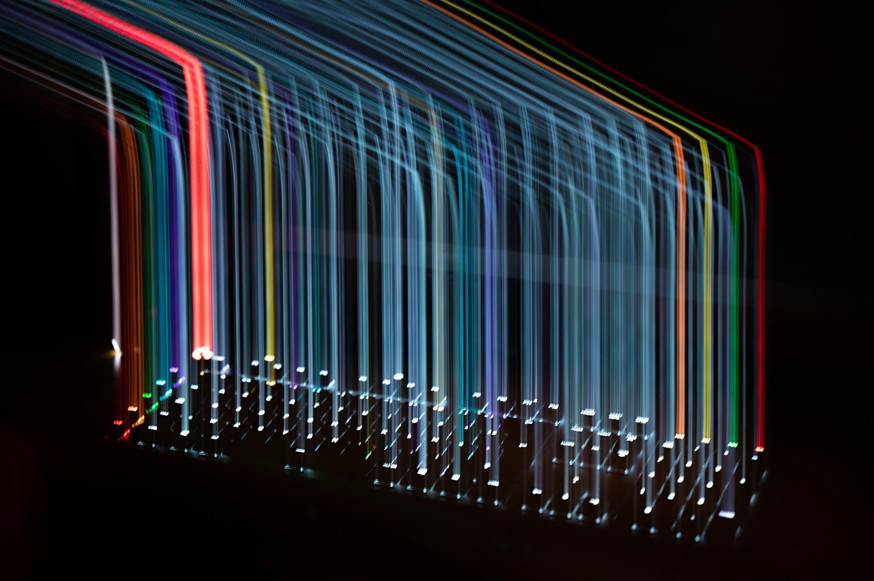 Long-exposure light trails through dark architecture — abstract systems imagery